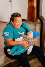 Diego with his Health Promoter, Surama.