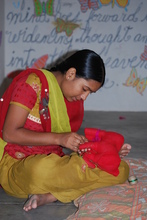 Sultana learning to sew