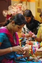 Graduates completing order for soft toys