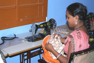 Student learning to make quilted bags