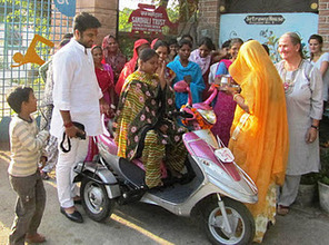Anita, receiving her new scooter!