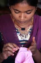 Komal sewing a bag in the Sewing Centre