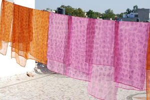 Block-printed scarves drying in the sun