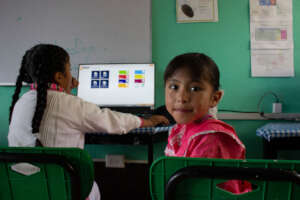 Girls using the computer in class.