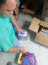 Volunteer packing the supplies