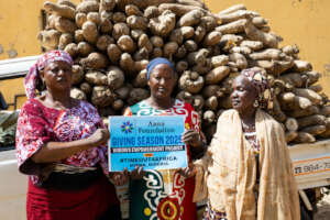 Our women standing in front of the yams truck