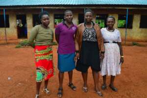 STAFF/VOLUNTEERS HELPING TO TEACH THE ORPHANS
