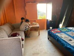 Kids doing homework with their new floor