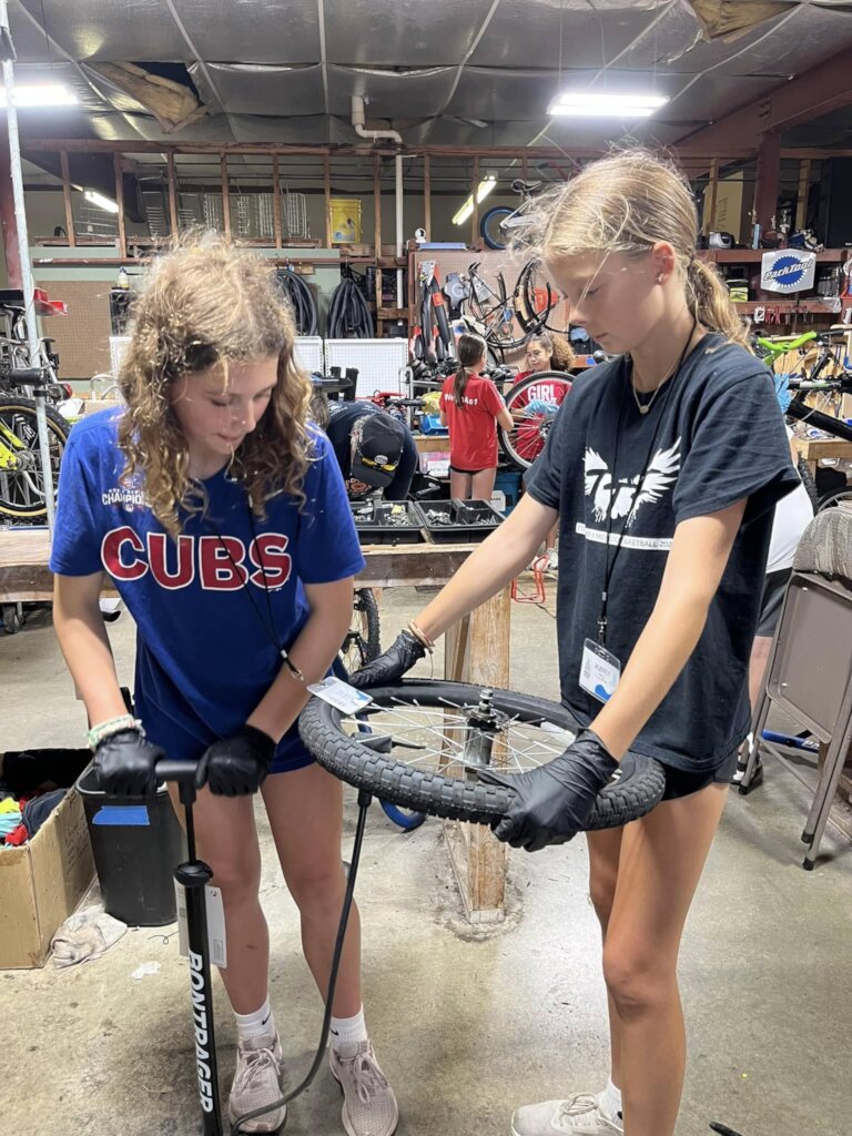 Youth repairing bikes