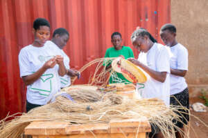 Champions making Baskets from fibers.
