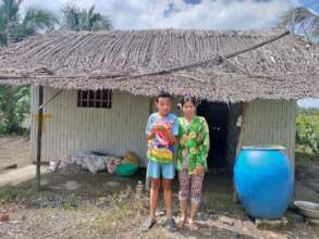 House made of palm leaves, bamboo, plastic sheets