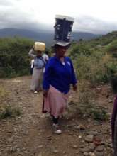 CLA members carry clean water for the vulnerable