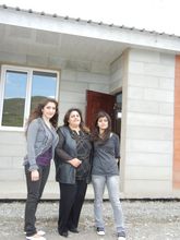 The Andreasyan family in front of new house