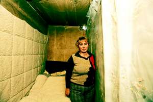 Nune Sakakyan, in her bedroom in metal conatiner