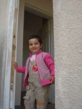 A child entering to her new house.