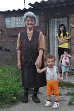 A family in front of their "home"