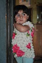 a child at the entrance of metal container-home