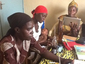 Mamas, and a baby, practice working with tablets
