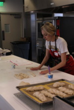 Challah For Hunger demonstration in the kitchen.