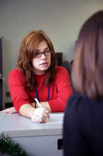 Mother applying for nutrition assistance