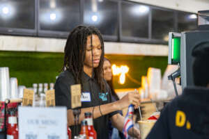Student Leaders make Lattes at Stamp the Passport