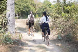 Girls cycling to school