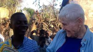 Young son of family in need with the director