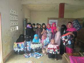 Jopay (blue scarf) with some of youth trainees