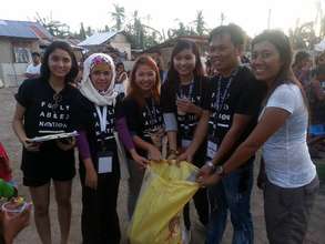 Ash with her Christian counterparts delivering aid