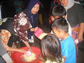 Children receiving hot delicious food