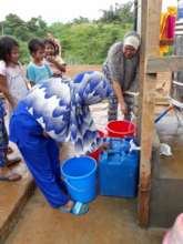 Women fetching water at Boganga Transitory Site