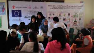 Selmiyah in center with blue hijab