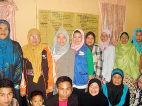 Babylove (in grey) with the women of Lumbatan