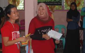 Nadjera working with her Christian colleague