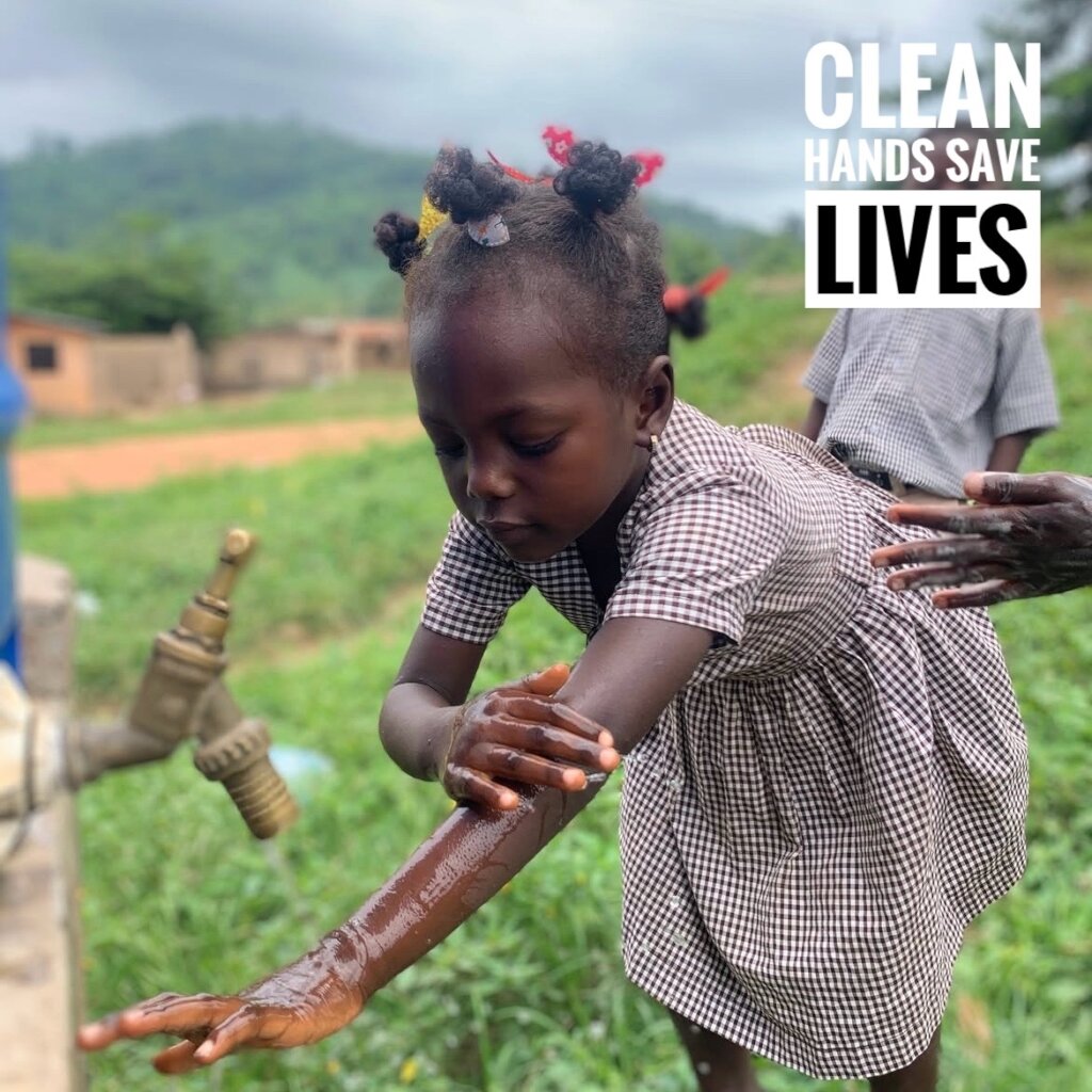 Young girl washing her hands