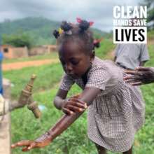 Young girl washing her hands