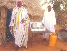 Mahdi Abu and his wife in front of their home.