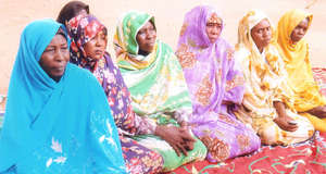 Women Participate in a Community Meeting