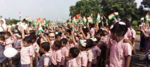 Children raising the flag of India.