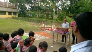 School assembly with flag-raising ceremony