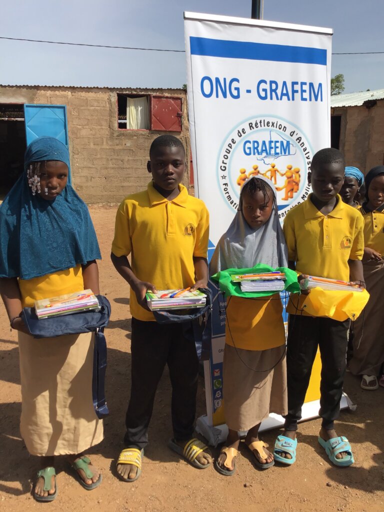 Displaced children receive school kits