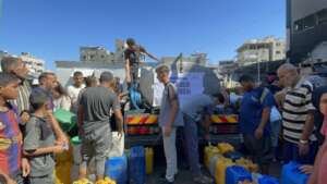Right holders filling their jerry can with water
