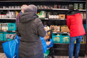 Clients Choosing Food in the Pantry