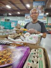 Volunteer Packing Food Hampers