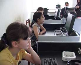Youth use computers in rural Armenia.