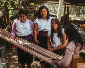 Artisans with backstrap loom
