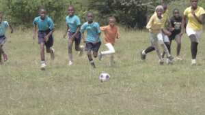 Girls play soccer