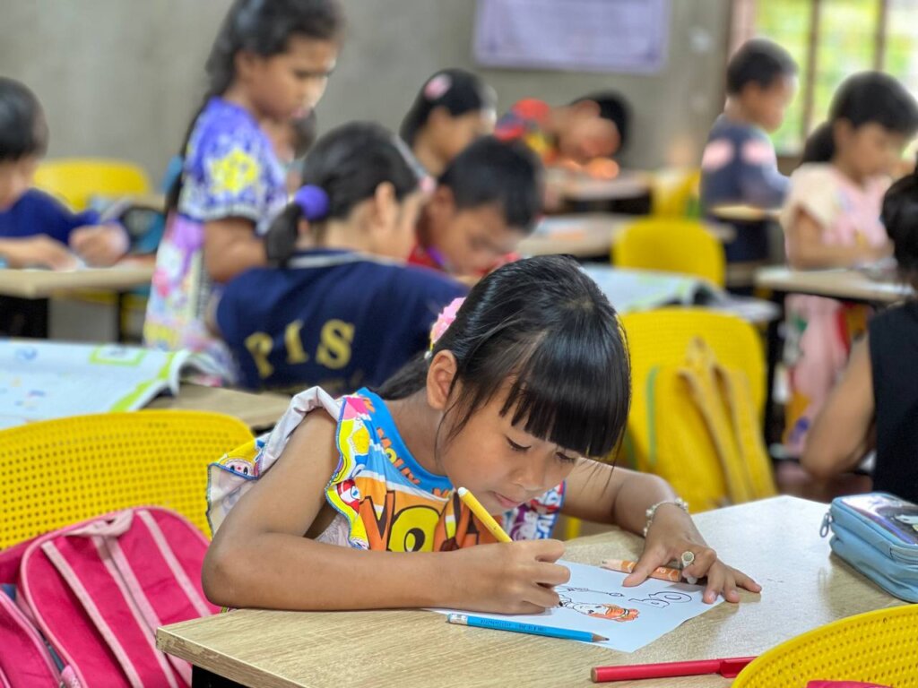 Kids are enjoying their coloring activity.