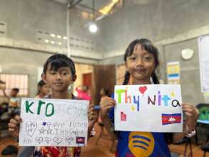 Our students proudly showing their name art.
