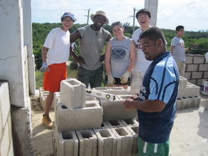Volunteers laying classroom blocks
